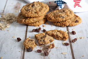 Fresh oatmeal raisin cookies stock photo containing baked and board