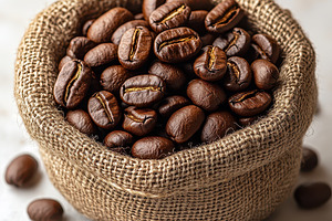 Roasted coffee beans in burlap sack, a Food & Drink Photo by Pixeness Studio