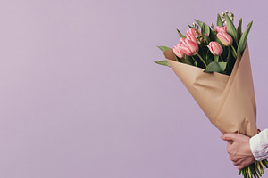 Holding a bouquet of pink tulips, a Photo by Beautiful things