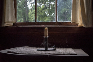 Old Candle in Cabin Window