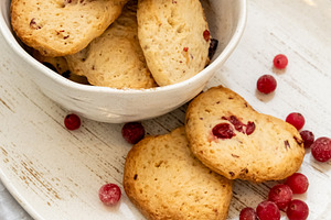 Homemade biscuits baked treats plate red berries, a Food & Drink Photo by Photo Drive Studio