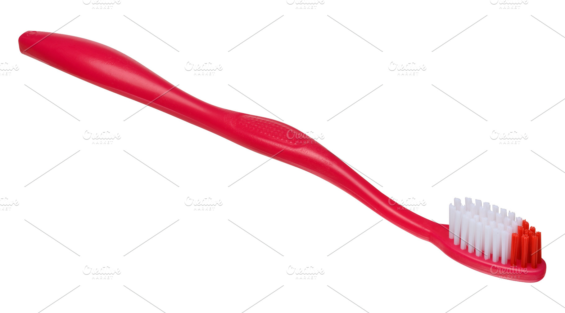 Plastic red toothbrush on isolated background, close up, a Health & Medical Photo by ndanko