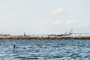 Airplane near sea runway, a Transportation Photo by SkyNext