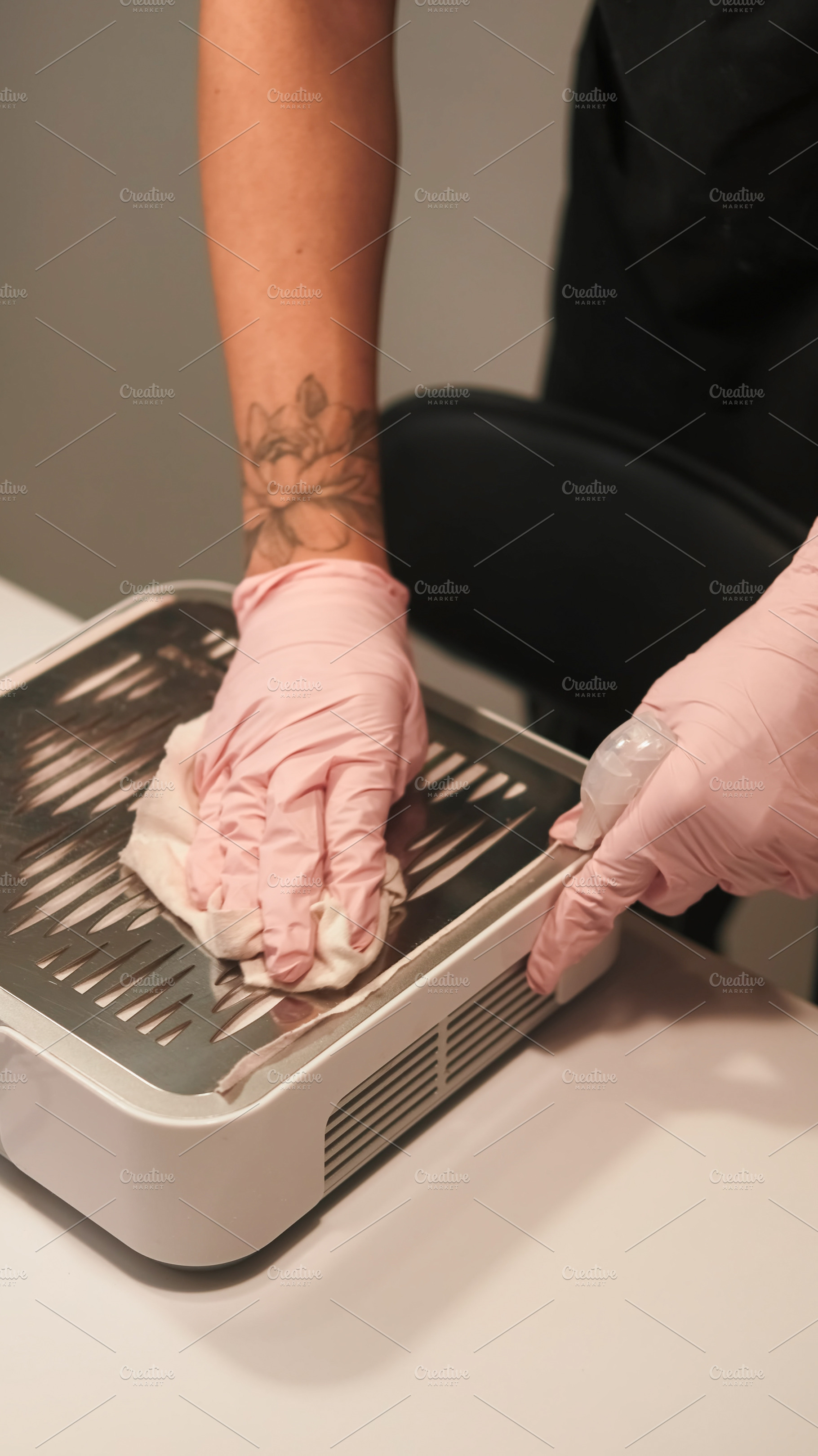 Beauty salon disinfection surfaces, a Person Photo by Photo Drive Studio