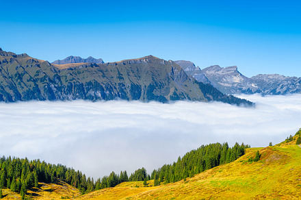 Mountain range through the clouds., a Nature Photo by Landscape and travel