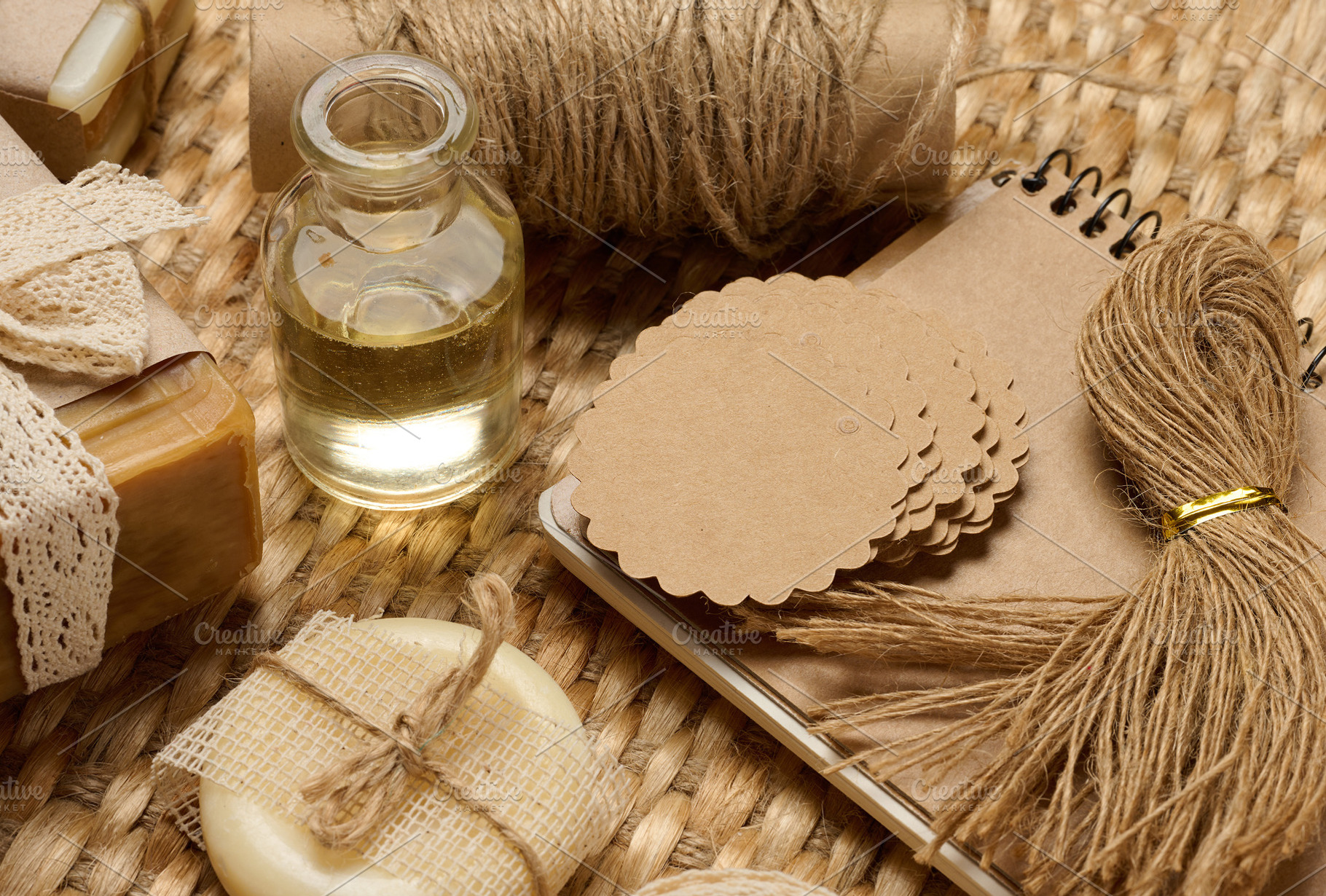 Handmade soap bars on marble stand and packaging items on table, a Food & Drink Photo by ndanko