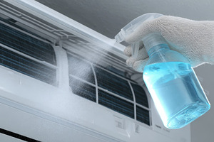 Cleaning Air Conditioner Unit with S, a Photo by Pixeness Studio