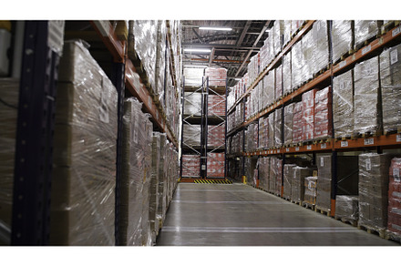 Close up of boxes on racks, goods in, an Industrial Photo by Media Whale Stock