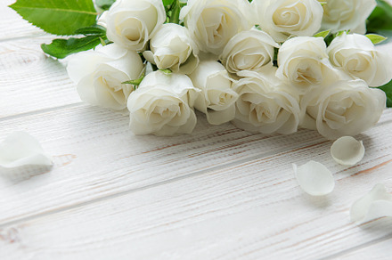 White roses on a wooden table, a Nature Photo by Olena Rudo