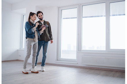Young couple with tablet moving and, a Person Photo by HalfPoint