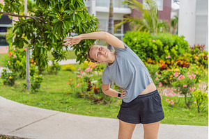 Unaltered woman exercising in a park, a Sports & Recreation Photo by Elizaveta Galitskaya
