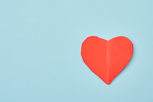Red paper heart on a soft blue background, minimalist compositio, a Holiday Photo by ndanko