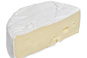 Half a head of Camembert cheese on an isolated background, a Food & Drink Photo by ndanko
