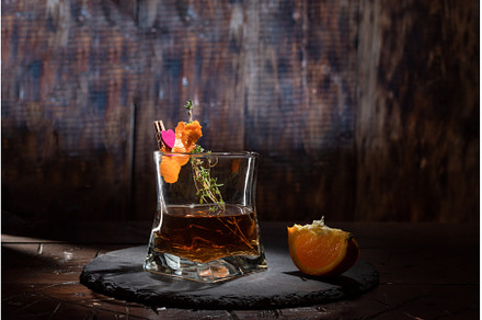Glass of whiskey garnished with, a Food & Drink Photo by Stockphoto by vzwer