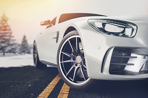 Front of the sports car featuring speed, travel, and traffic