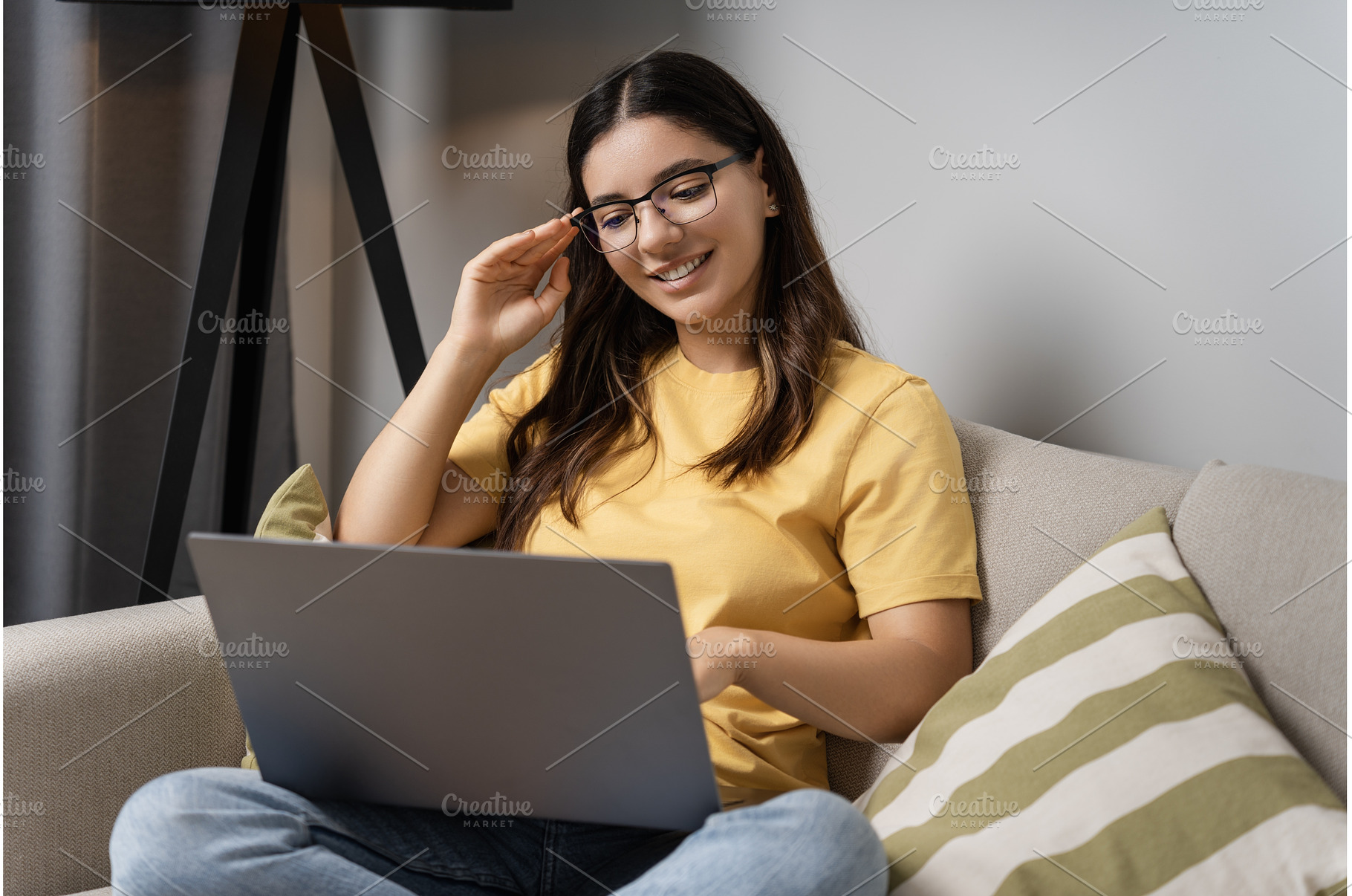 Relaxed on the sofa, a woman in, a Person Photo by AD Stock Images