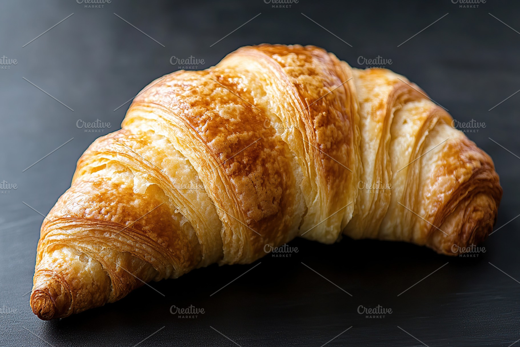 French pastry croissant on black background, a Food & Drink Photo by AlyaAnd