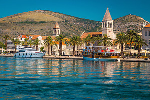Moored ships and waterfront walkway, an Architecture Photo by Alpine Dreams