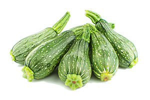 Green zucchini isolated on white background, a Food & Drink Photo by AlyaAnd
