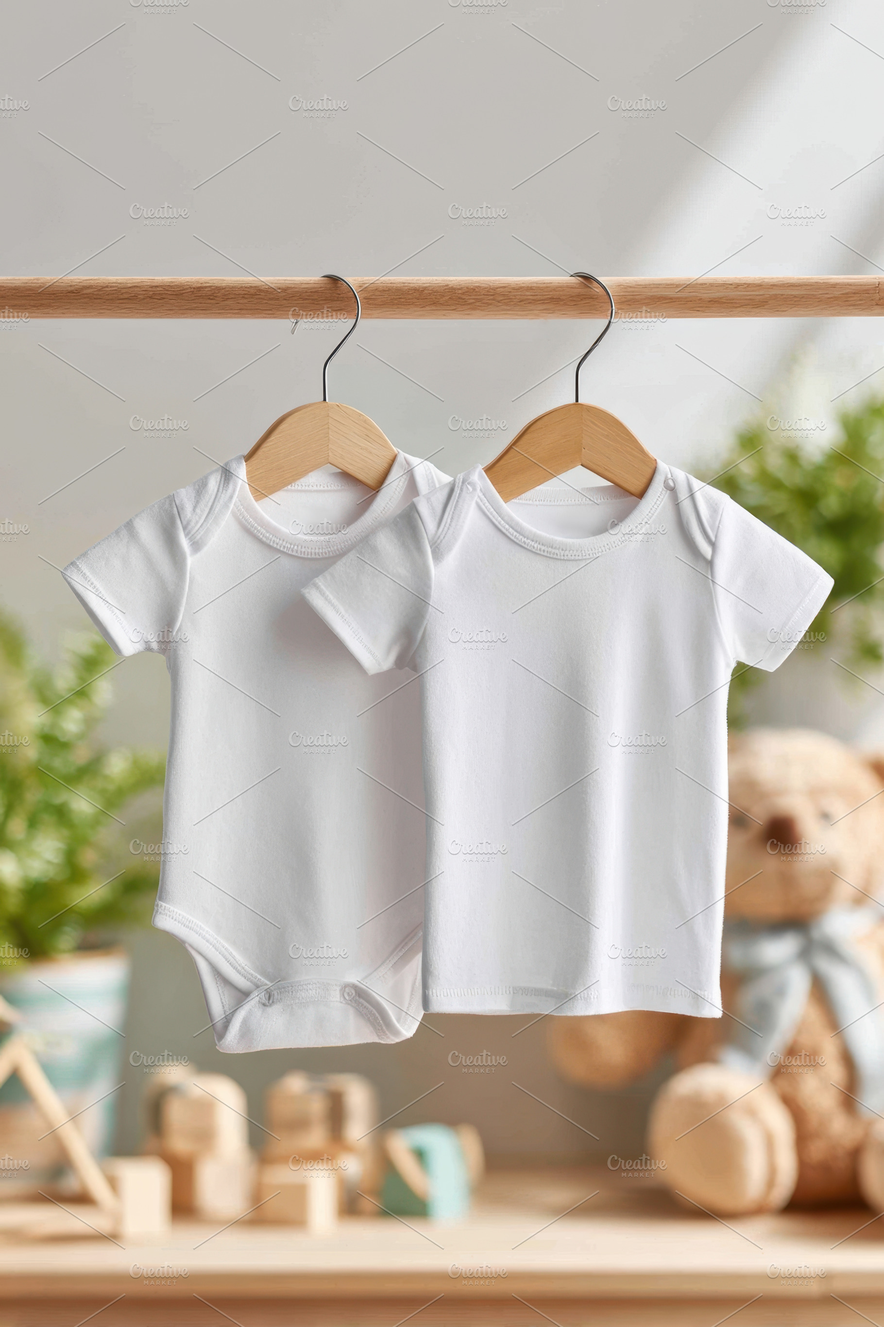 Two white baby clothes on hangers, a Beauty & Fashion Photo by AlyaAnd