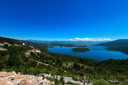 Breathtaking panoramic view of a serene mountain lake landscape. Slansko Lake,, a Photo by AS photostudio