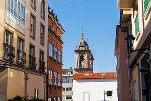 Historic rooftops and dome of the Church of St. George in La Cor, an Architecture Photo by Bepslabor
