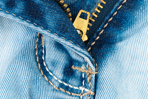 Blue denim jeans texture with brass
