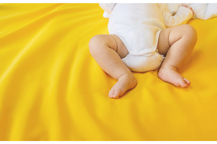 Baby feet on a yellow background, a Person Photo by yanadjana