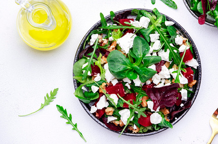 Beet and feta cheese healthy salad with arugula, lamb lettuce, m, a Food & Drink Photo by 5PH