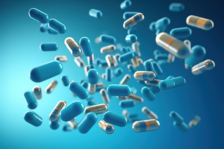 Illustration of different falling medicine pills on blue background, a Health & Medical Photo by AlyaAnd