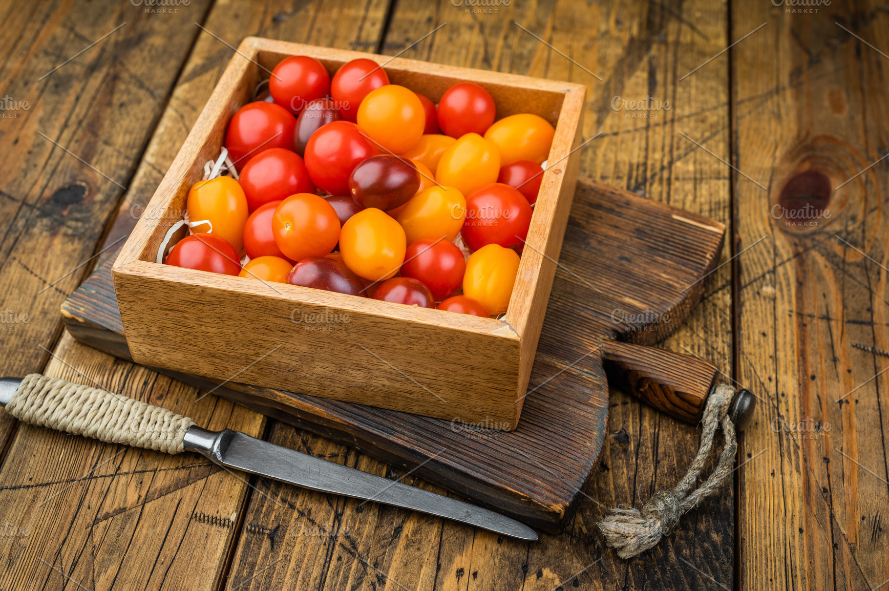 Rustic farm style mix of cherry tomatoes in a wooden crate clean, a Food & Drink Photo by composter-box@mail.ru