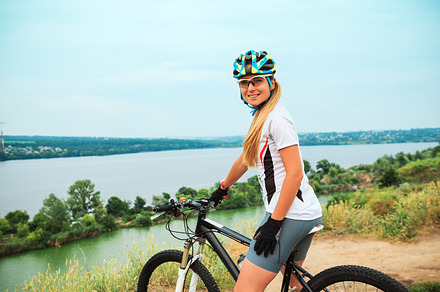 Young girl riding bicycle outside healthy lifestyle containing cyclist, a Sports & Recreation Photo by Volodymyr Melnyk