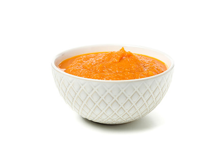 Bowl of pumpkin soup isolated on white background, a Food & Drink Photo by AtlasStudio PRO