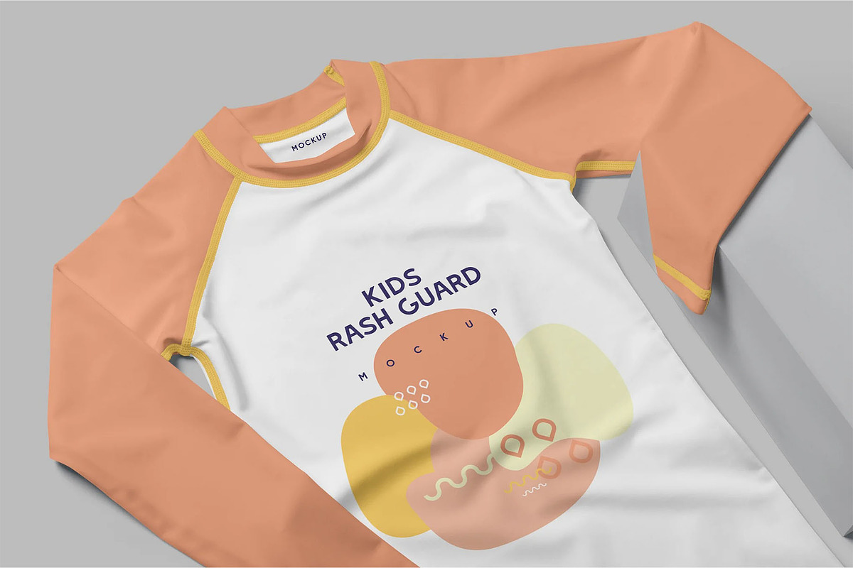 Kids Rash Guard Mockups, a Shirt Mockup by megostudi0 (Photo 2 of 7)