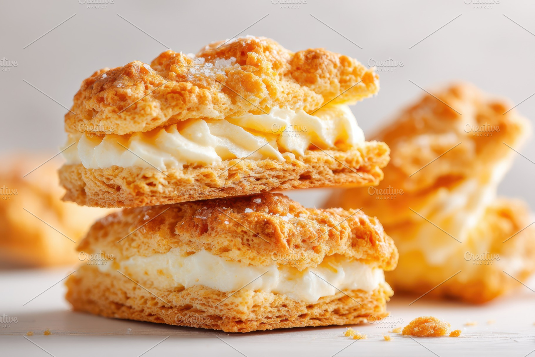 Stacked cream-filled flaky pastries, a Food & Drink Photo by AlyaAnd