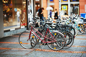 Parked Bicycles On Sidewalk.