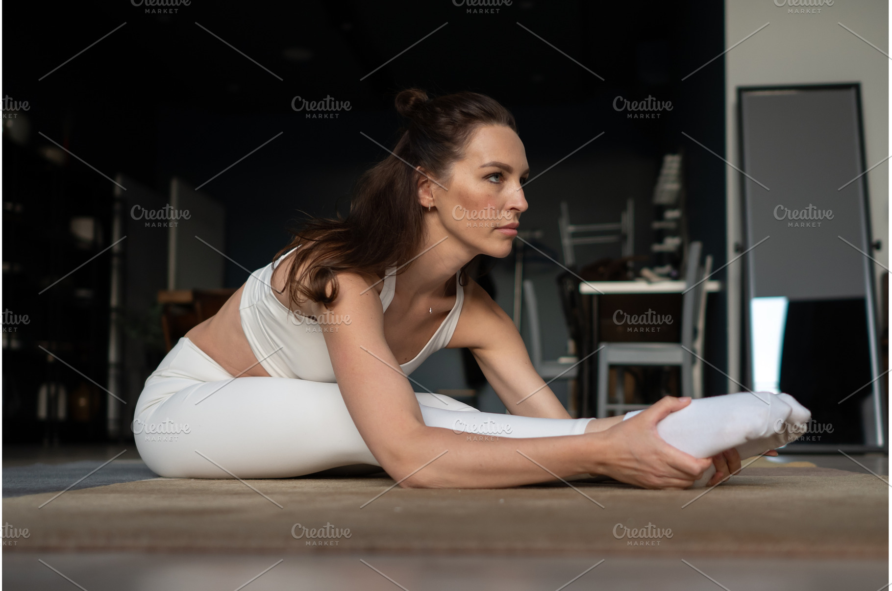 Woman doing stretching yoga exercise, a Sports & Recreation Photo by undrey