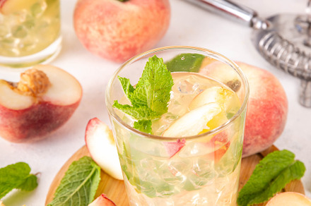 Flat chinese peach and lime lemonade, mojito cocktail