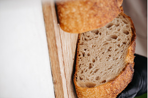 Fresh rustic sourdough bread on, a Food & Drink Photo by HalfPoint