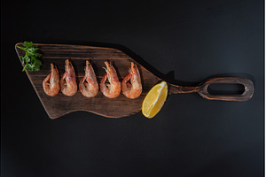 Boiled shrimps on a cutting board, a Food & Drink Photo by Stockphoto by vzwer