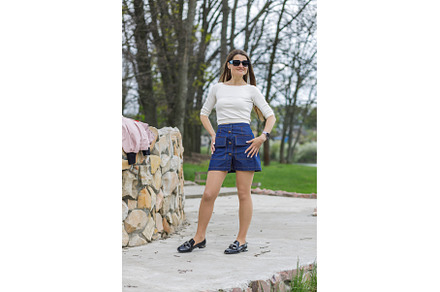 Young woman in short denim skirt and, a Person Photo by serkum
