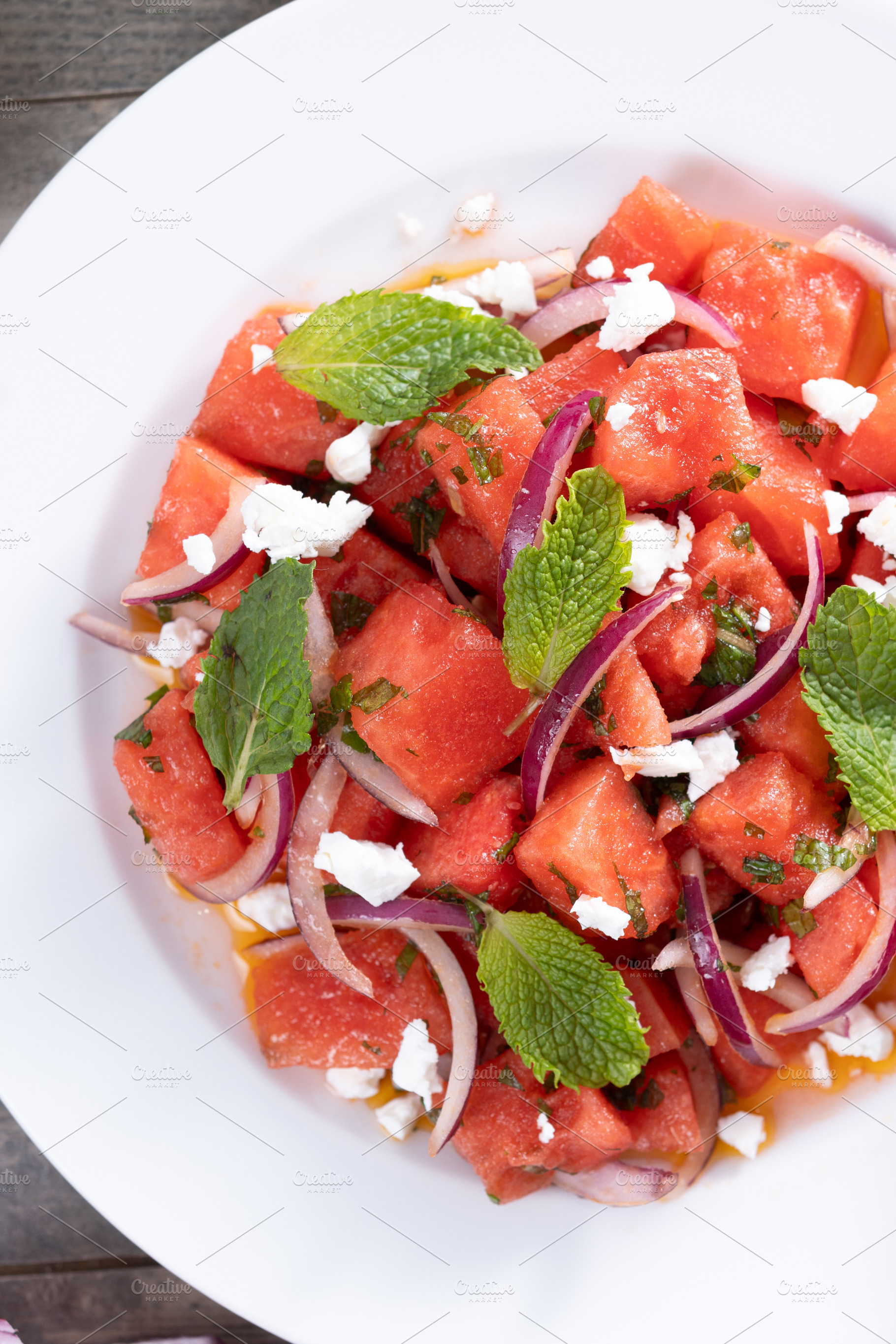 Fresh Watermelon Feta Salad with Mint and Red Onion on wooden ta, a Food & Drink Photo by etorres69