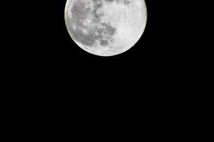 Full moon in the black sky.