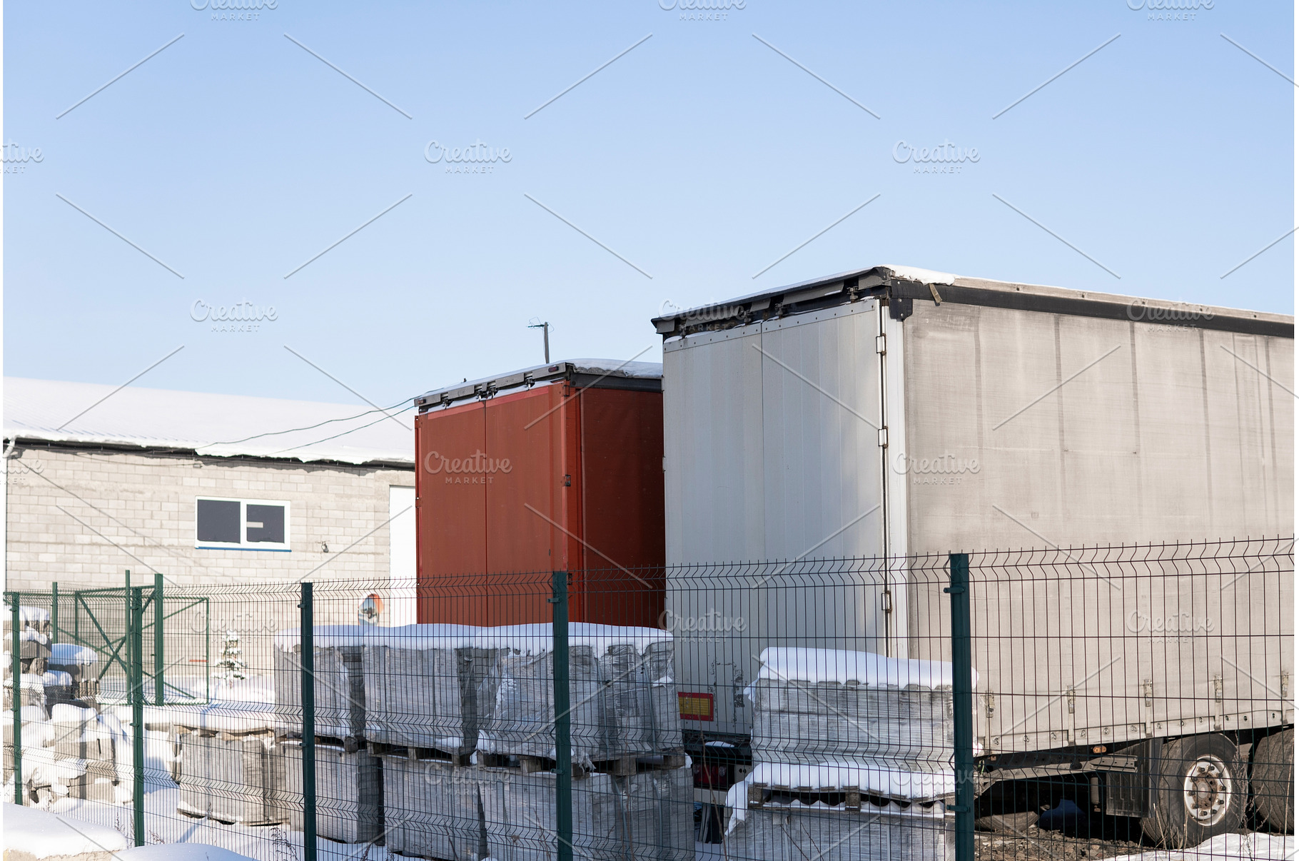 Snowy logistics yard with trailers, a Transportation Photo by volodymyrshtun13795