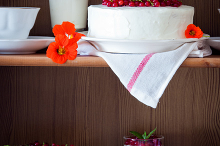 Cakes on shelves containing afternoon tea, bakery, and berry
