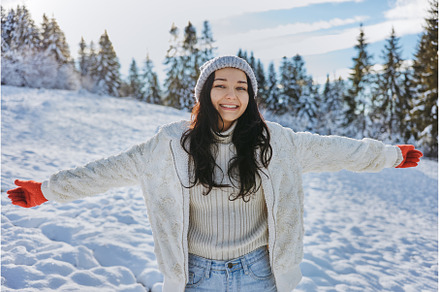 Woman in Winter Clothes Raised Hands, a Person Photo by Emotion photo