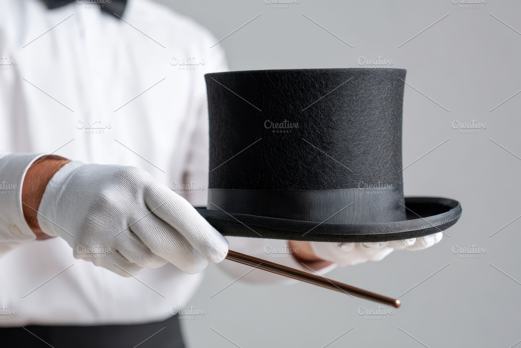 Magician holding a top hat and wand, an Arts & Entertainment Photo by AlyaAnd