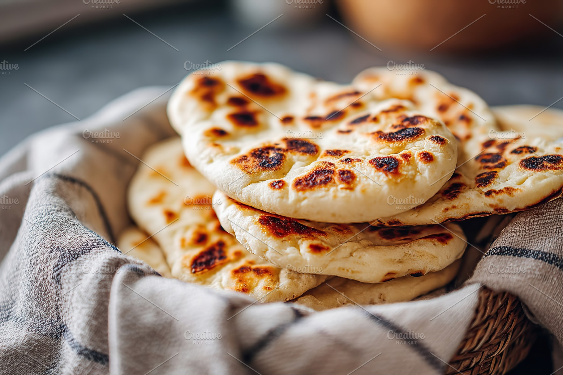 Freshly baked bread with golden crust resting in a cozy basket lined with a clo, a Food & Drink Photo by AlyaAnd