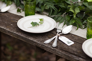 Rustic table setting containing dish, decoration, and meal