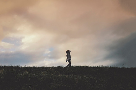 Boy Walking Across Grass With A Map preview 4